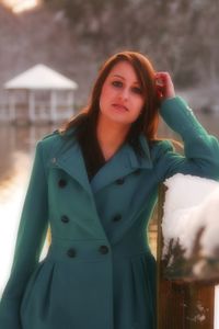 Portrait of beautiful young woman standing outdoors