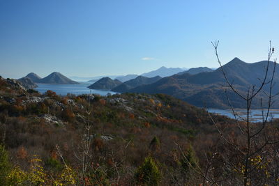 Scenic view of mountains against clear blue sky