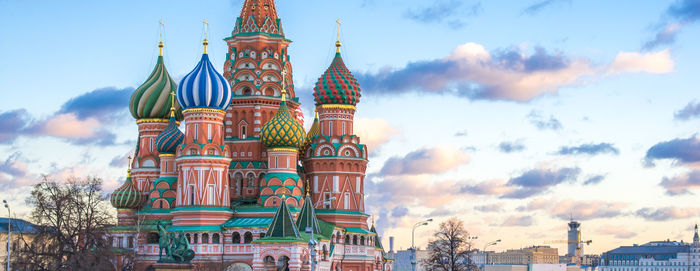 Low angle view of temple building against cloudy sky