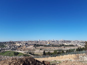 Panoramic shot of townscape against clear blue sky