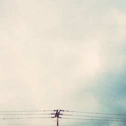 Low angle view of man against sky during sunset