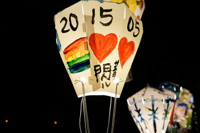Close-up of heart shape painted on paper lantern