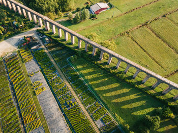 High angle view of railroad tracks on field