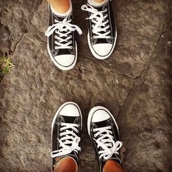 Low section of man standing on footpath
