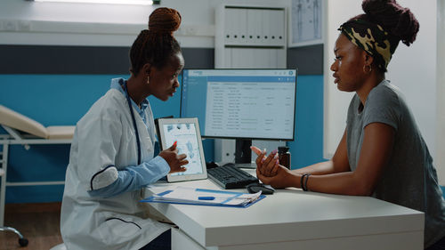 Side view of doctor working at clinic