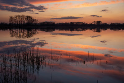 Beauty clouds after sunset reflecting in the surface of the lake