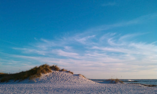 Scenic view of sea against sky during winter