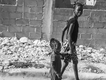 Sisters walking on footpath