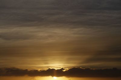 Low angle view of dramatic sky during sunset