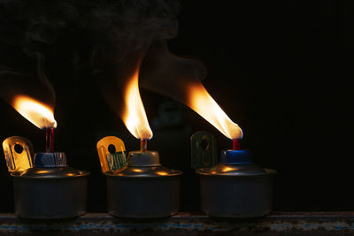 Close-up of burning candles