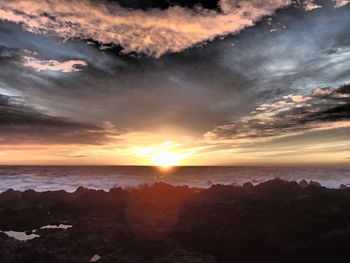 Scenic view of sea at sunset