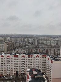 High angle view of buildings in city against sky