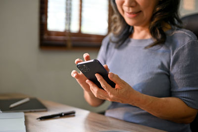 Young woman using mobile phone