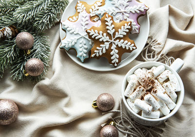 Christmas background with decorations, cocoa and gingerbread cookies.