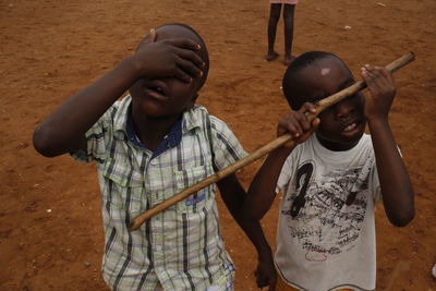 Boy playing with umbrella