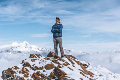 View of man standing on snow covered mountain