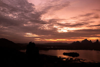 Scenic view of lake against sky during sunset