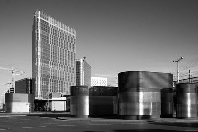 Modern buildings in city against clear sky