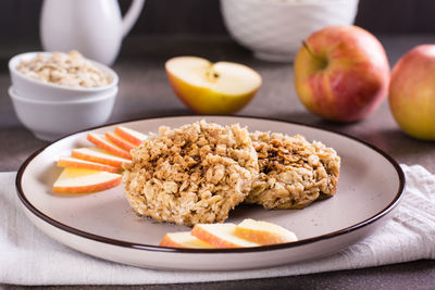 Apple crumble pancakes and fresh apples on plate. homemade desserts.