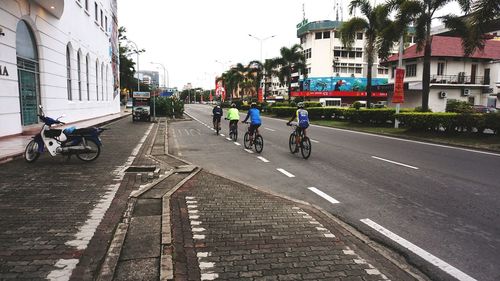 People walking on road in city