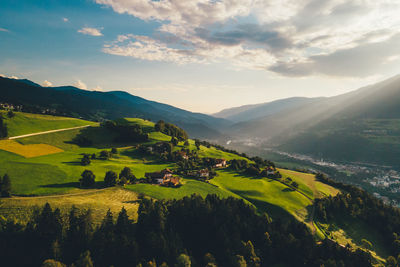 Scenic view of landscape and mountains against sky