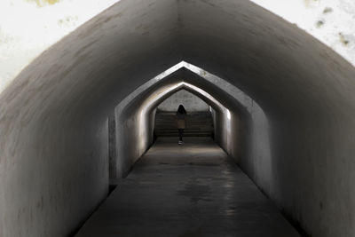 Rear view of man in tunnel