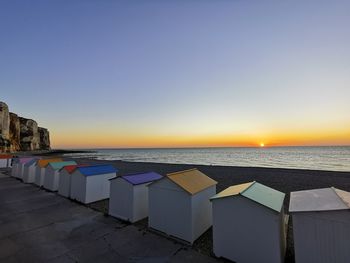 Scenic view of sea against clear sky during sunset