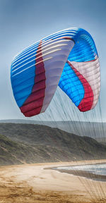 Multi colored umbrella against the sky