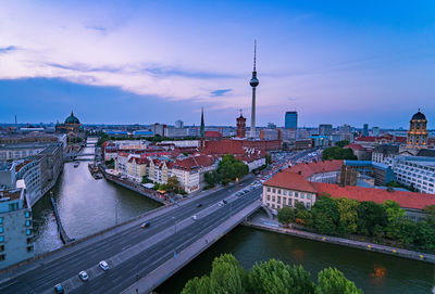 Bridge over river with buildings in background