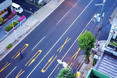 High angle view of road marking amidst buildings in city