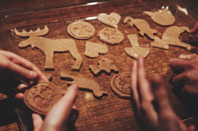 Midsection of person holding cookies