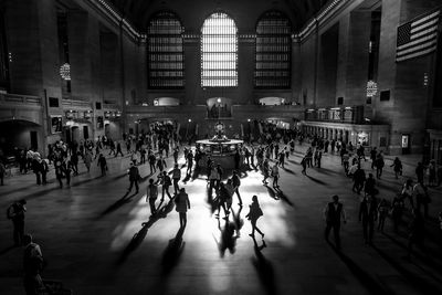 People walking on railroad station platform