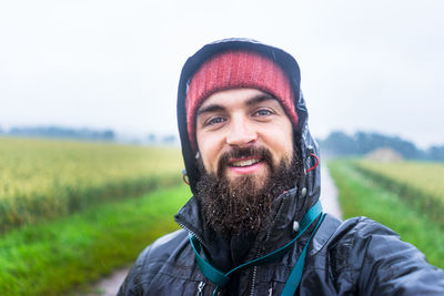 Portrait of smiling man on field
