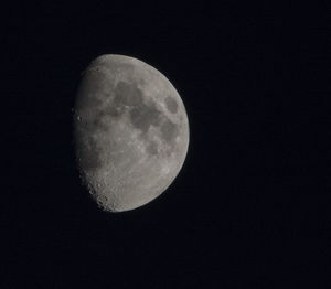 Low angle view of moon against sky at night