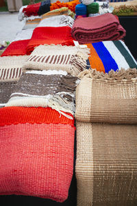 Various blankets for sale at market stall