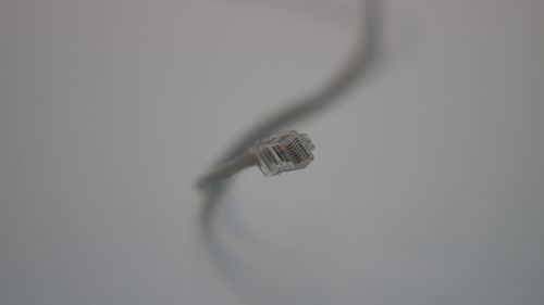 Close-up of cables over white background