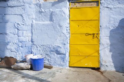 Yellow closed door of old building