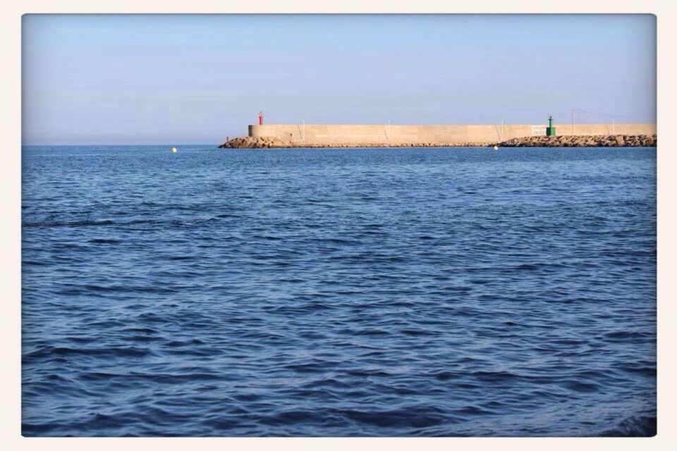 sea, transfer print, water, horizon over water, auto post production filter, blue, sky, tranquil scene, tranquility, waterfront, scenics, built structure, nature, rippled, beauty in nature, ocean, architecture, day, seascape, outdoors