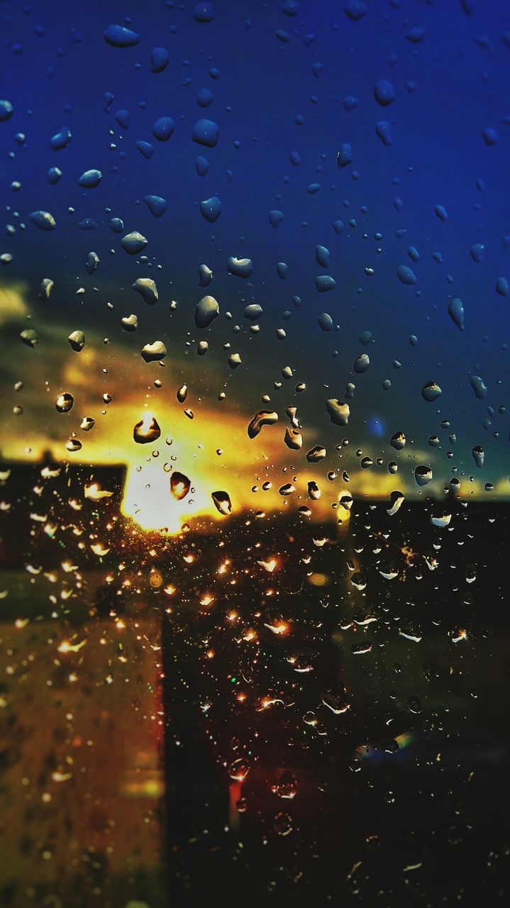 drop, wet, window, transparent, indoors, glass - material, rain, water, raindrop, glass, season, weather, full frame, backgrounds, sky, focus on foreground, close-up, illuminated, vehicle interior, monsoon