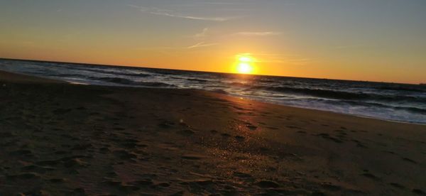 Scenic view of sea against sky during sunset