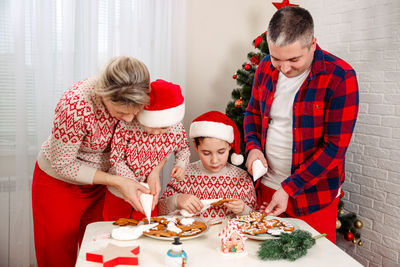 Children chef concept. kids baking christmas cookies. santa helper.