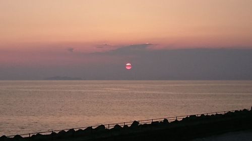 Scenic view of landscape against sky during sunset