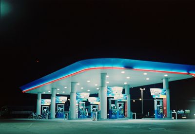 View of illuminated store at night