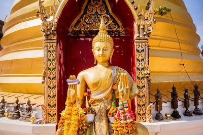 Statue of buddha outside building