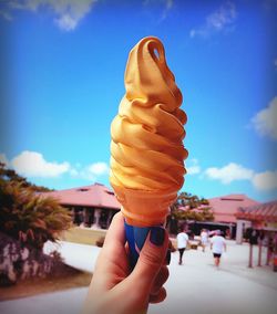 Cropped image of woman holding ice cream cone