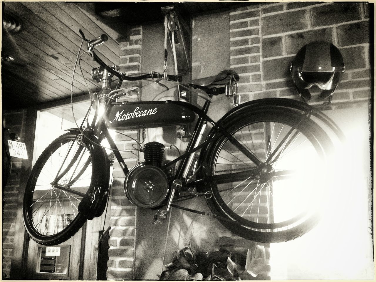 bicycle, architecture, mode of transport, built structure, transportation, indoors, land vehicle, transfer print, stationary, parking, auto post production filter, parked, building exterior, wall - building feature, wheel, day, city, sunlight, no people, motorcycle