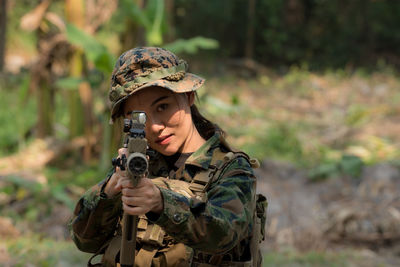Portrait of mature man holding camera