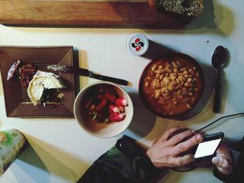 High angle view of man having food on table