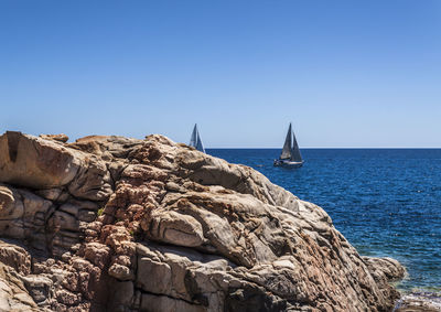 Scenic view of sea against blue sky