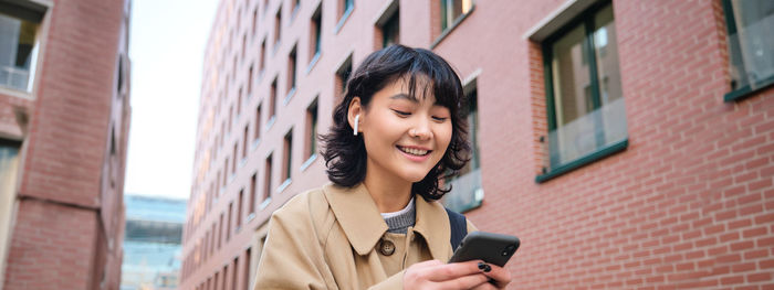 Young woman using mobile phone